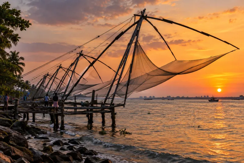 Chinese fishing nets beside Fort Kochi at sunset